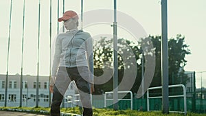 Athlete woman waiting in the starting block on running track 4k