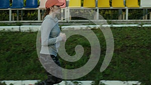 Athlete woman waiting in the starting block on running track 4k