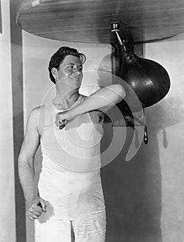 Athlete working out with a punching bag