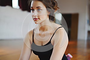 Athlete young woman doing exercise at gym. Indoors.