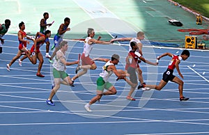 Athletes on the 4 x 100 meters relay race