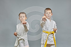 Athletes beat a punch with a hand on a gray background