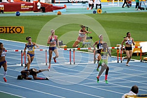 Athletes compete in the 400 meters hurdles final