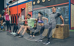 Athletes exercising doing box squats
