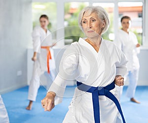 Athletes have starting position and repeating sequence of punches and painful techniques in kata