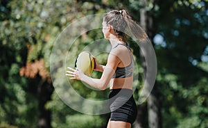 Athletes Having Fun Throwing Ball in a Sunny Park