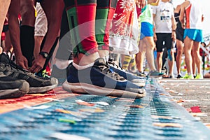 Athletes legs close-up in front of the start line