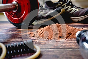 Athletes need to consume extra protein powder supplement, in the image with cocoa flavor, to improve their sports performance