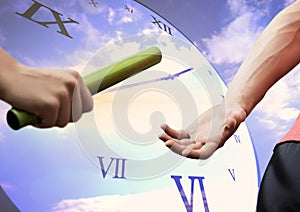 Athletes passing the baton against digitally generated clock in background