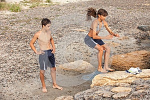 Athletes performs freerunning jump on stones