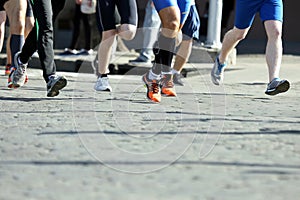 Athletes run marathons on the pavement
