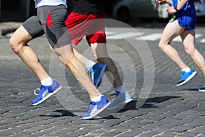 Athletes run marathons on the pavement