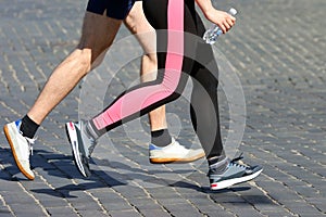 Athletes run marathons on the pavement