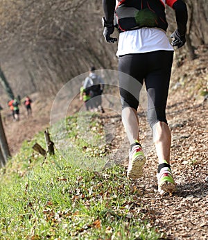 Athletes running the race in the mountain trail in winter