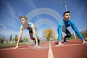 Athletes at the sprint start line in track and field