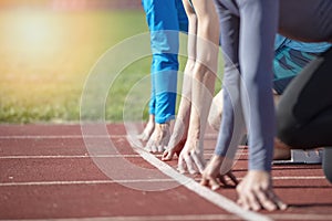 Athletes at the sprint start line in track and field