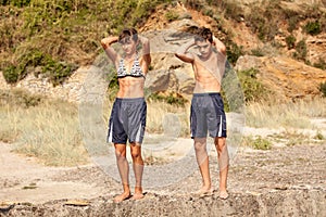 Athletes stands on a rock