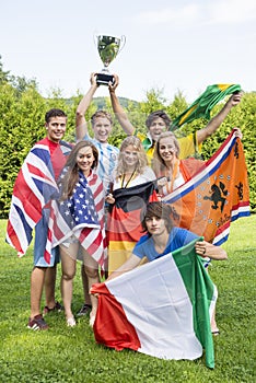 Athletes With Various National Flags Celebrating In Park