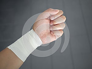 Athleteâ€™s sprained wrist taped up with a wrist tape job
