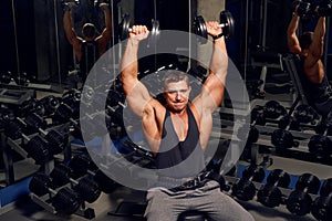 Athletic, adult man exercising in the gym