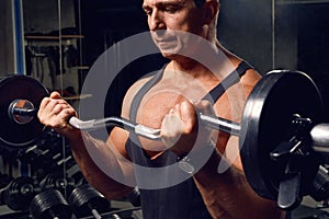 Athletic, adult man exercising in the gym