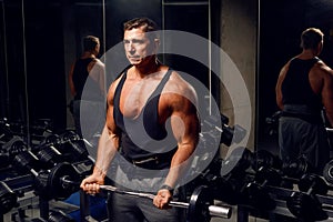 Athletic, adult man exercising in the gym