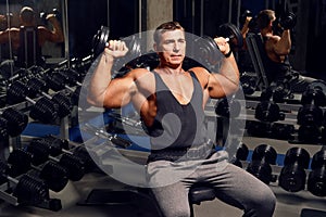 Athletic, adult man exercising in the gym