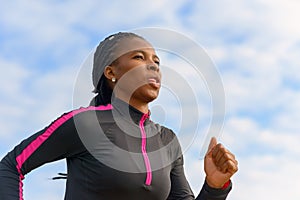 Athletic African woman out for her daily jog