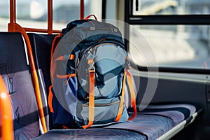 athletic backpack on a stadium shuttle bus seat