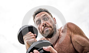 Athletic body. Dumbbell gym. Muscular man exercising with barbell. fitness health diet. sport. Perfect six pack. scary