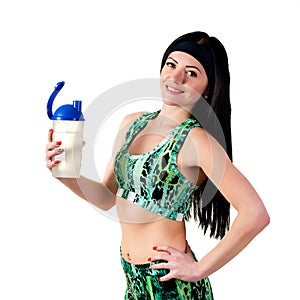 Athletic brunette girl holding a bottle of drinking water.