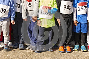 Athletic children ready to start a cross country race. Outdoors