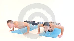 Athletic Couple Doing Push Ups