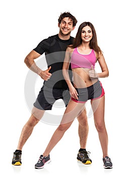 Athletic couple - man and woman with thumb up on the white