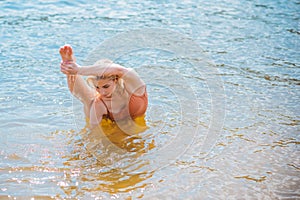 Athletic exercises at beach, healthy lifestyle