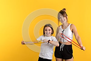 Mom and daughter workouts in studio