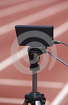 Athletic finish line photoelectric cell control device and running track photo