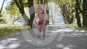 Athletic fitness sport motivated runner child girl training, preparing to run race marathon, start