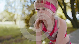 Athletic fitness sport motivated runner child girl training, preparing to run race marathon, start