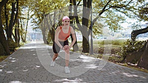 Athletic fitness sport motivated runner girl training, preparing to run race marathon, start in park