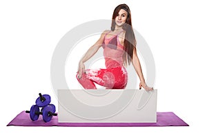 Athletic fitness woman with sign board blank helthy sport isolated white background black clothes yoga poses