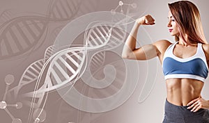 Athletic fitness woman standing among DNA chains.