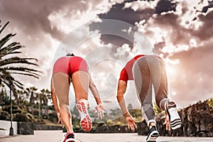 Athletic friends doing running endurance sport exercises outdoor - Sporty motivated people doing sprint workout session