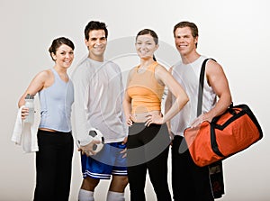 Athletic friends in sportswear with soccer ball