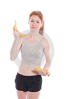 Athletic girl with bananas in hand