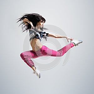 Athletic girl dancing jumping