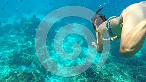 Athletic Girl Diving Underwater. Snorkeling Young Woman Swimming in Blue Cristal Clear Water. HD. Similan, Thailand.