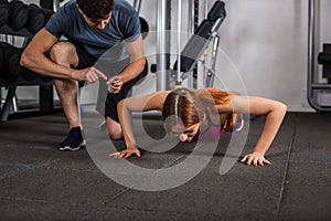 Athletic girl performs push-ups