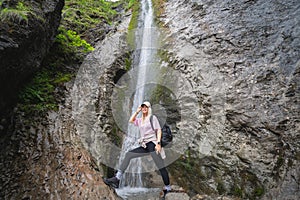 Athletic girl traveler at the Siklawica waterfall in Zakopane Poland