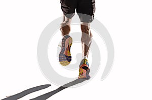 Athletic legs and running shoes of sport man jogging in fitness healthy endurance concept in advertising style